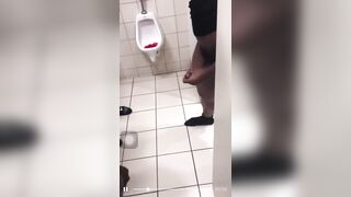 Group of horny guys stroking their cock in public toilet