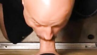 Bald gay eating a tasty smooth white cock thru a glory hole