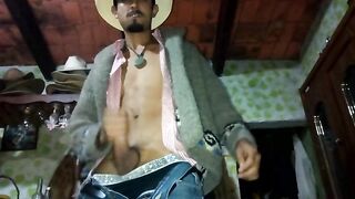 Horny latin cowboy jerks off with his jacket on