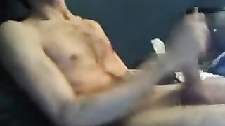 Stroking his big uncut cock