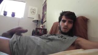 Cute bearded dude stroking his cock in front of the webcam