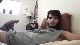 Cute bearded dude stroking his cock in front of the webcam