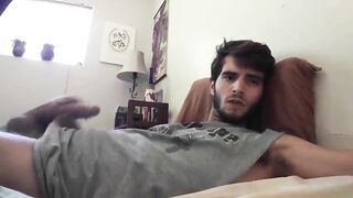 Cute bearded dude stroking his cock in front of the webcam