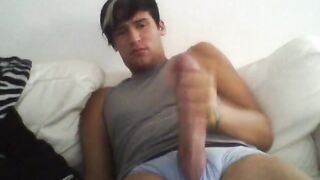 Young peruvian guy stroking his long cock