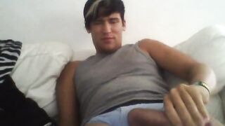 Young peruvian guy stroking his long cock