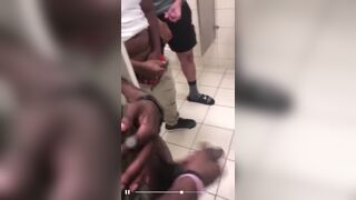 All together jerking off in a public bathroom
