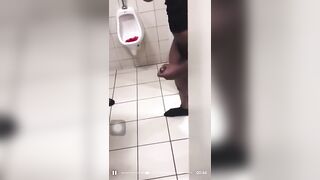 All together jerking off in a public bathroom