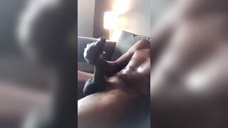 Horny black stroking my huge cock while i watch porn