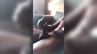 Horny black stroking my huge cock while i watch porn