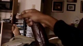 Horny black stroking his fat beefy cock
