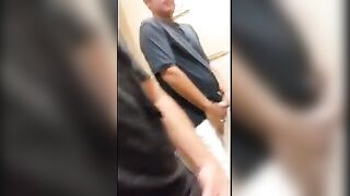 Two strangers masturbate in the urinal