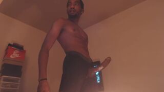 Black dude rubbing his huge and tasty fat cock solo