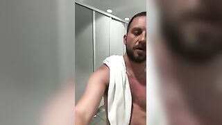 Stud wanking in a public toilet with a happy face