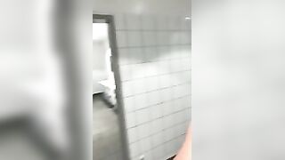 Stud wanking in a public toilet with a happy face