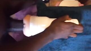 Black guy using his new toy while shooting a huge load