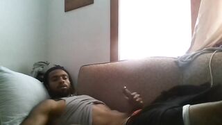 Hot jamaican dude wanking his cock on his sofa