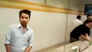 Group of guys rubbing their cock in a public bathroom