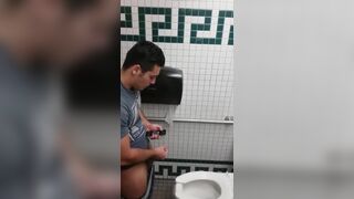 Caught a handsome guy stroking his cock in the toilet
