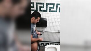 Caught a handsome guy stroking his cock in the toilet