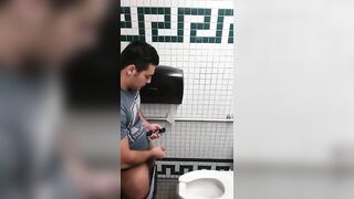 Caught a handsome guy stroking his cock in the toilet