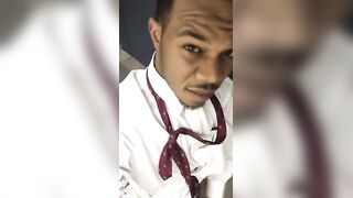 Horny nigga shows off his huge donkey cock in front of a bathroom mirror