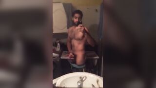 Cute fit arab guy strokes his cock in front of the mirror