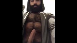 Hairy bearded bear strokes his cock outdoor