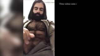 Hairy bearded bear strokes his cock outdoor