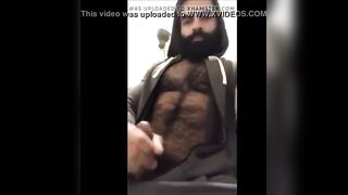 Hairy bearded bear strokes his cock outdoor