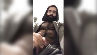 Hairy bearded bear strokes his cock outdoor