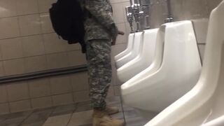 Spying a military guy stroking his cock in a toilet