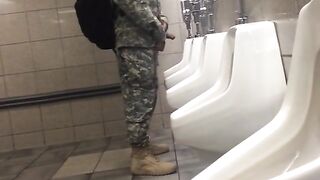Spying a military guy stroking his cock in a toilet
