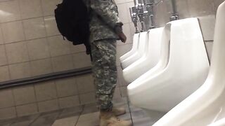 Spying a military guy stroking his cock in a toilet