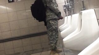 Spying a military guy stroking his cock in a toilet