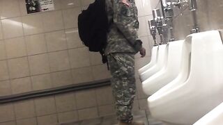 Spying a military guy stroking his cock in a toilet